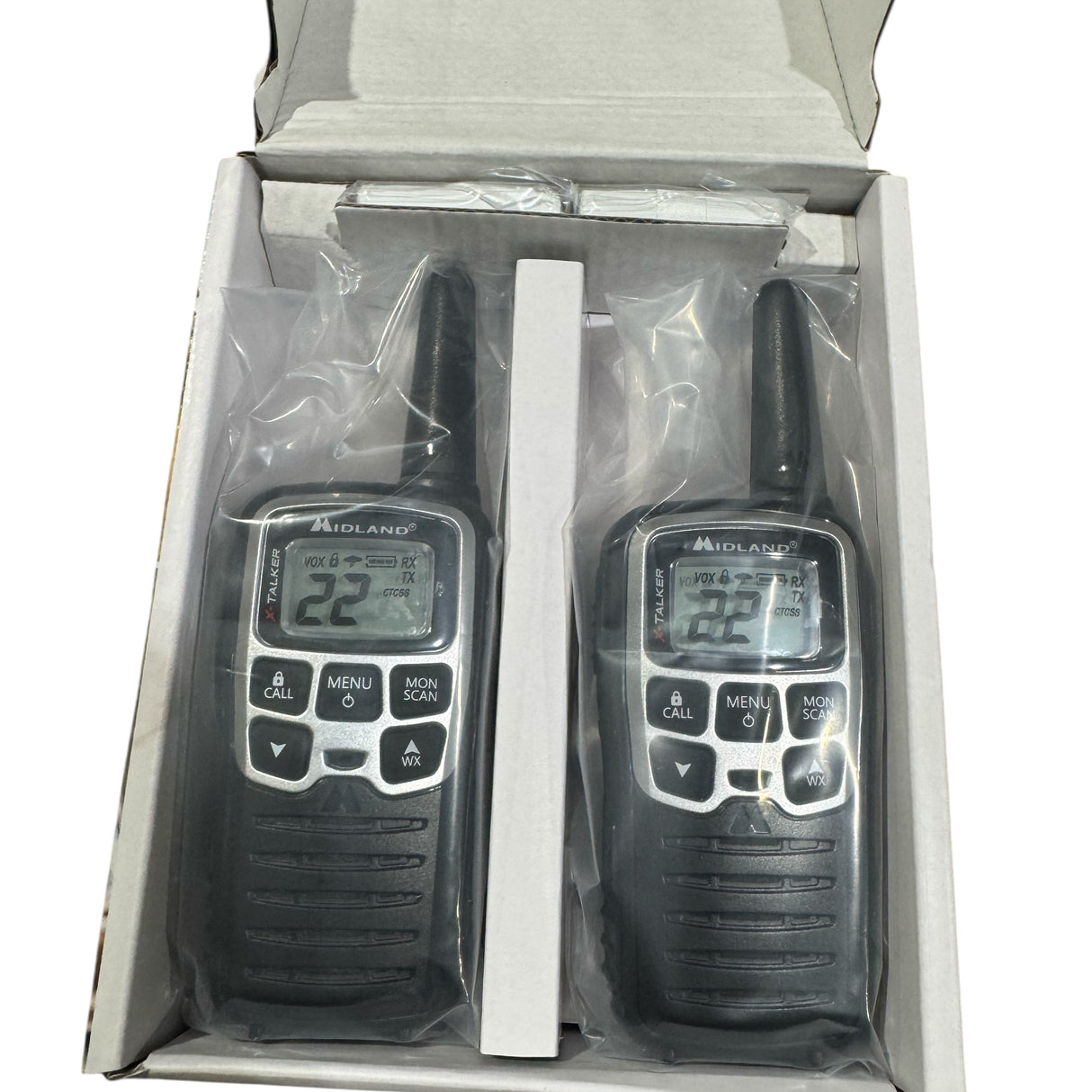 Two walkie talkies in a packaging box on a white background