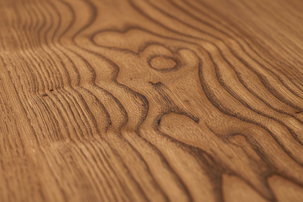 "High-quality macro photograph of premium [lumber type] showing detailed wood grain texture and natural color. Clean, well-lit studio shot focusing on the surface texture and quality of the wood. Sharp focus, professional product photography style."